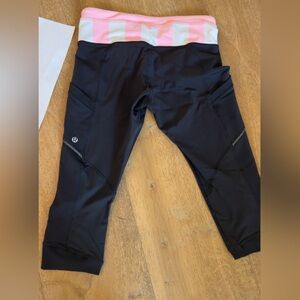 Women’s Lululemon black leggings with bright pink and white waist. Sz 6